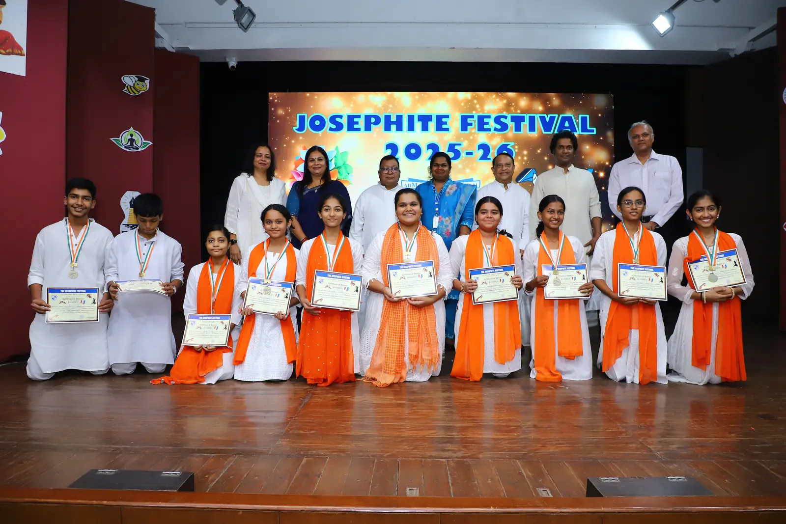 Award-winning students celebrating together on stage